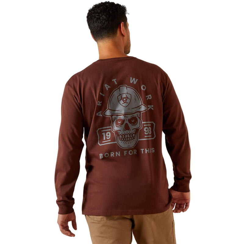 Man wearing a maroon long-sleeve shirt with a graphic design on the back against a beige background