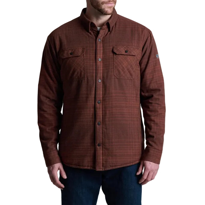 Brown plaid shirt worn by a person on a white background