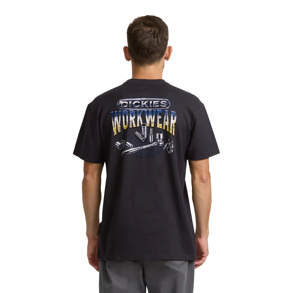 A man viewed from behind wearing a black Dickies short-sleeve t-shirt with a large graphic on the back, paired with gray pants, against a plain white background.