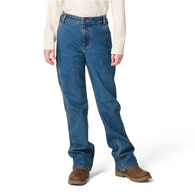 A person wearing medium blue straight-leg denim jeans, a cream long-sleeve top, and brown boots, photographed against a clean white studio background.